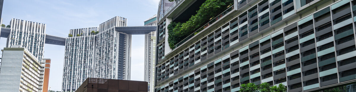 Modern Singapore business exterior with professionally maintained greenery and vibrant landscape creating an inviting, premium brand impression