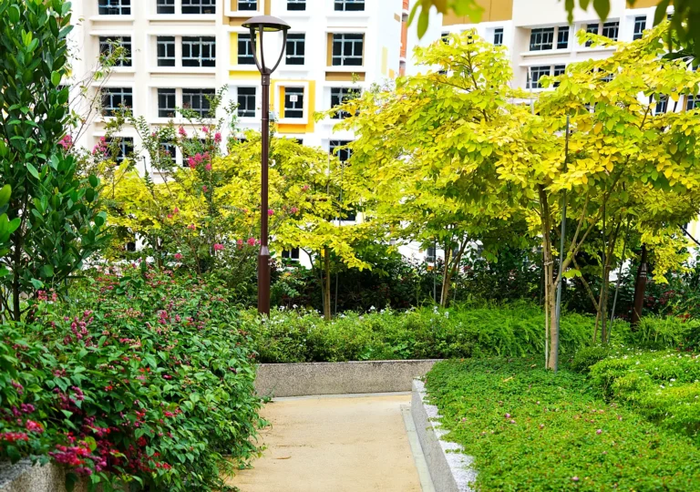 Landscaped walkway with trees and shrubs at Garden Court @ Tengah