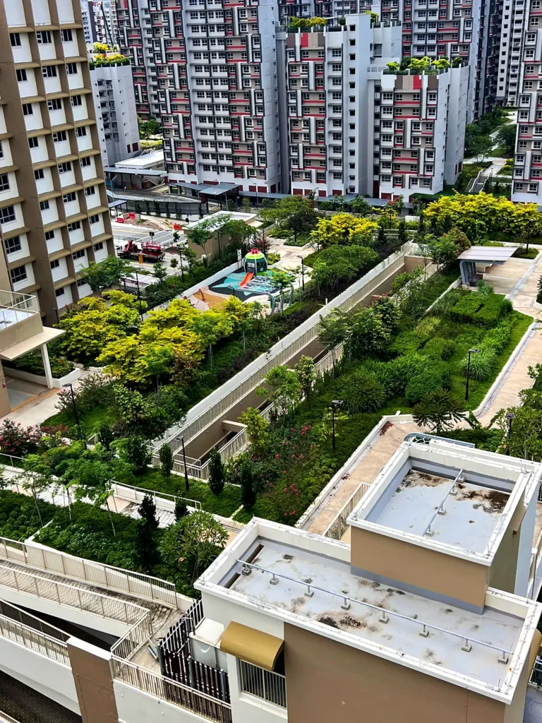 Rooftop park with planted beds and a playground at Garden Terrace @ Tengah